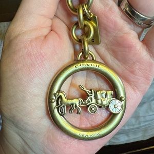 Coach horse & carriage brass keychain.